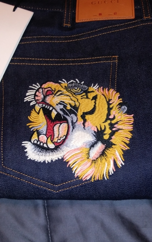 Gucci tiger head jeans
